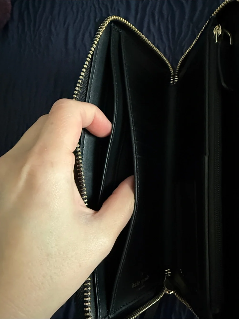kate spade black pebbled leather wristlet clutch with gold logo